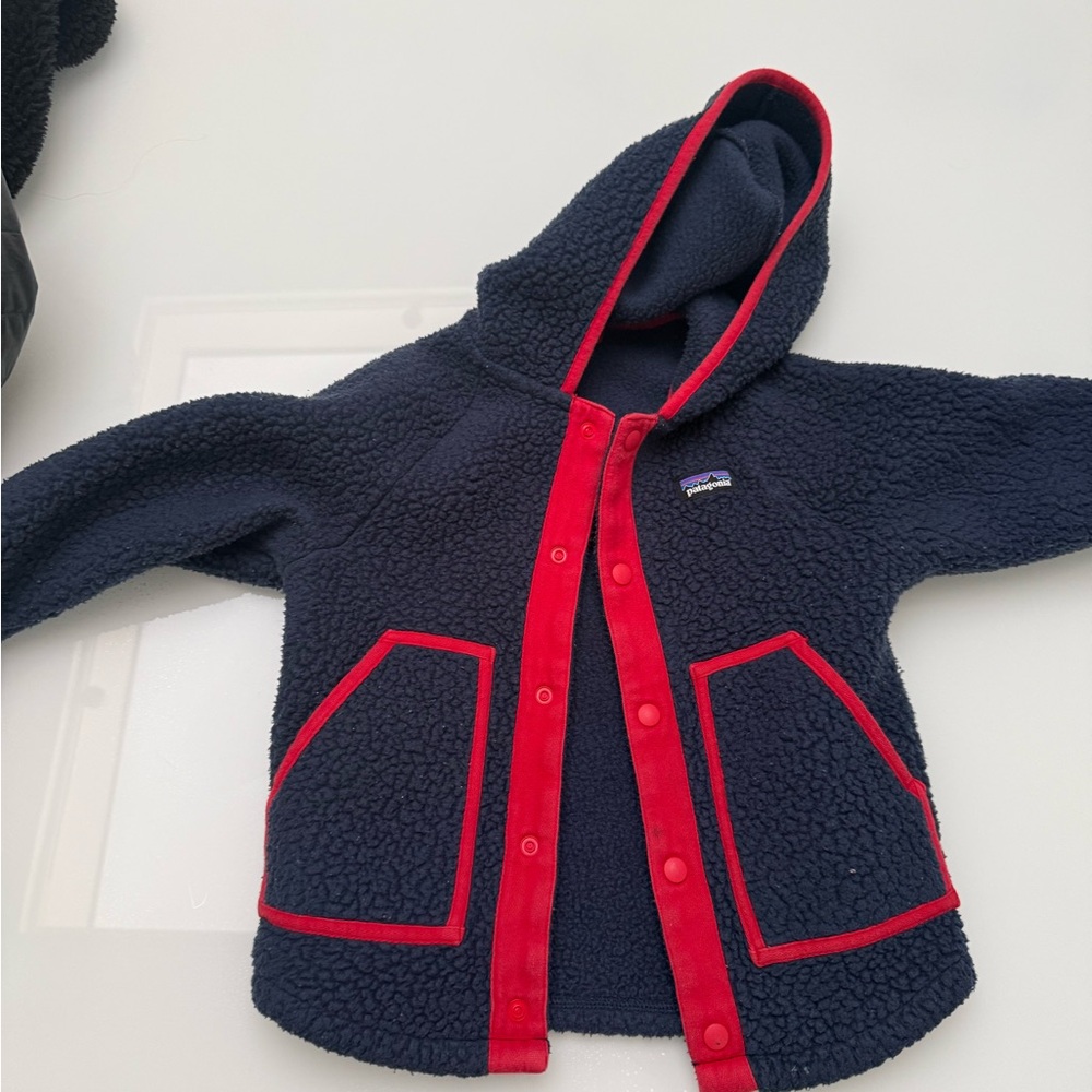 Patagonia Dark Blue Fleece with Bright Red Accents